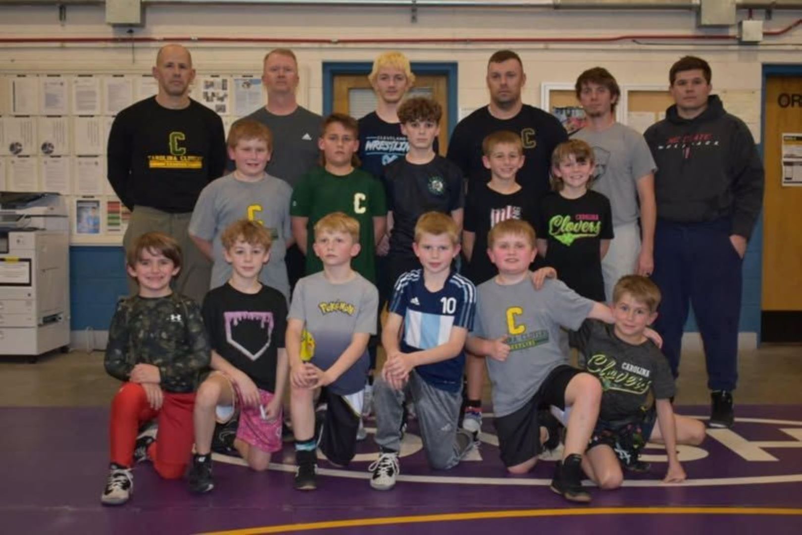 Young wrestler practicing a move